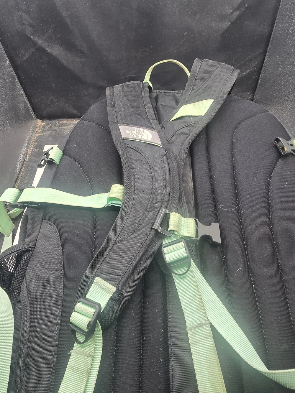 The North Face Black Backpack with Mint Green Bungee and Straps